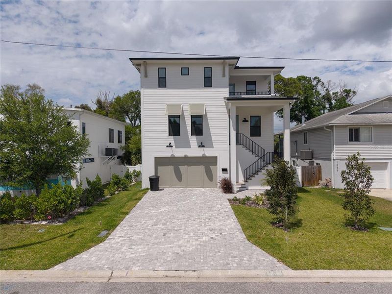 Front exterior of a new home in , St. Petersburg, FL, highlighting curb appeal (Image 25).