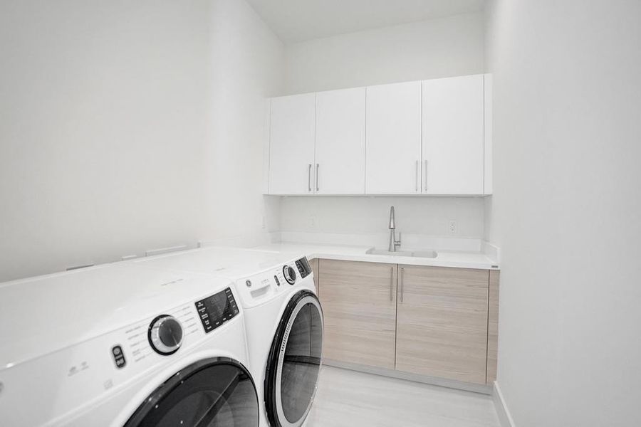 Laundry Room — First-Floor Laundry with Custom Cabinetry, Laundry Sink, and Upgraded Washer and Dryer