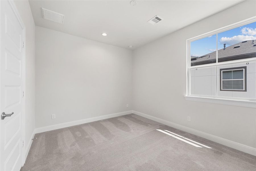 Spacious, unfurnished interior of a new home in The Corner At Buffalo Pointe, Houston (Image 20).