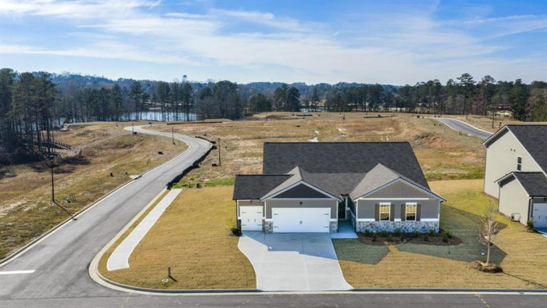 Front exterior of a new home in Fairway 17 at Mirror Lake, Villa Rica, GA, highlighting curb appeal (Image 19).