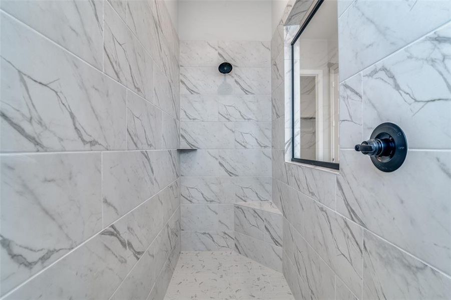 Bathroom with a tile shower