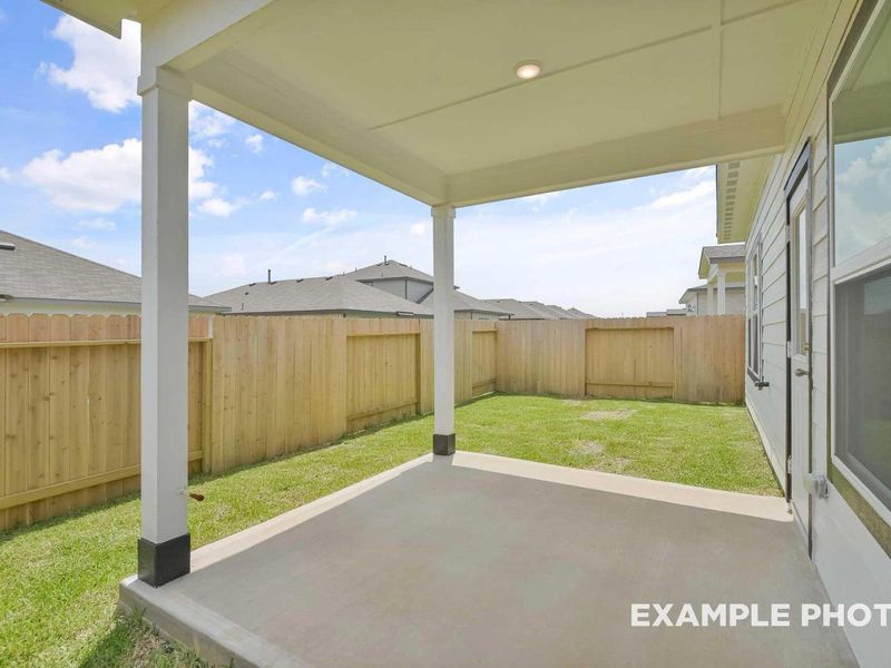 Exterior details and patio area of a home in Caney Creek Place, Conroe (Image 2).