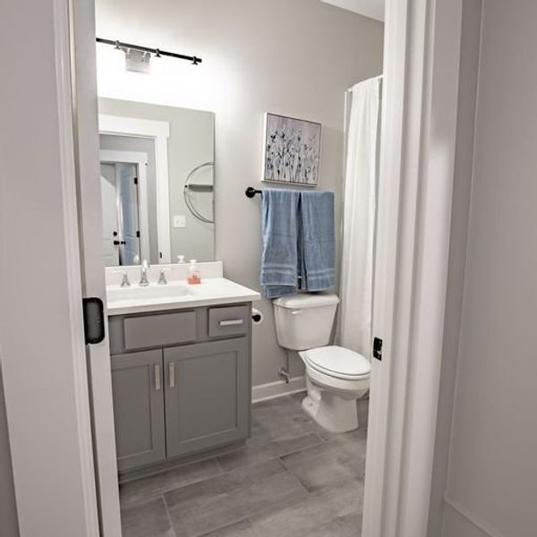 Representative furnished interior of a home built from the Willow by Grant & Co in Manor at Hall Creek, Arlington (Image 10).