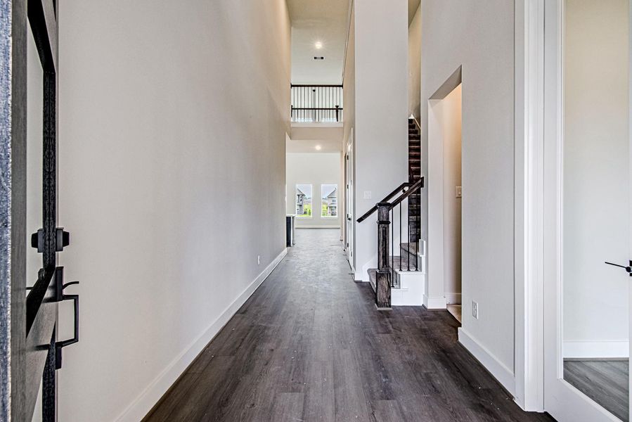Bright foyer with soaring ceilings and elegant flooring Bright foyer with soaring ceilings and elegant flooring