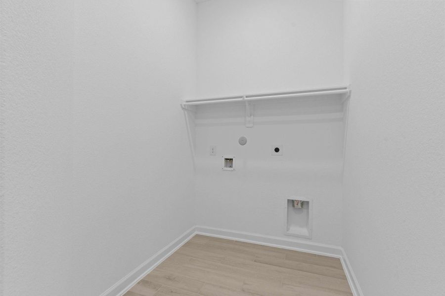 This utility room is huge and all your laundry needs!