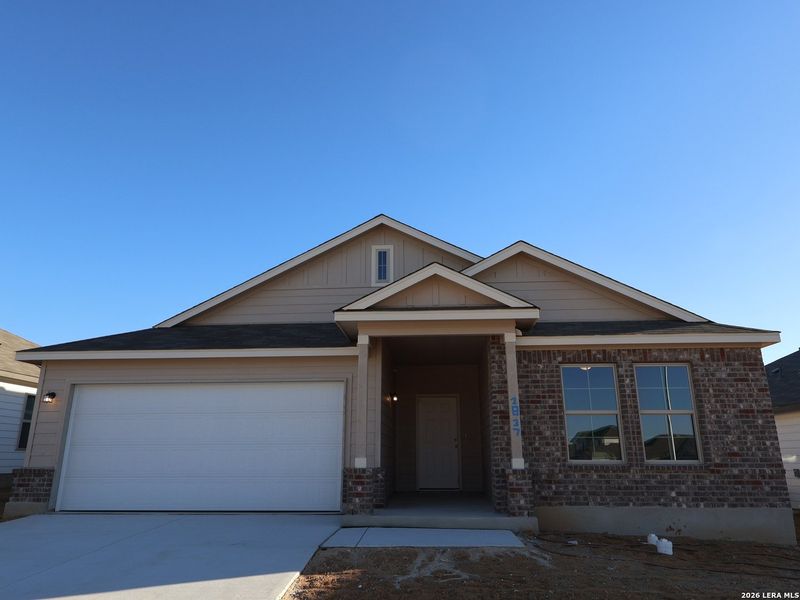 Front exterior of a new home in Greenspoint Heights, Seguin, TX, highlighting curb appeal (Image 19).