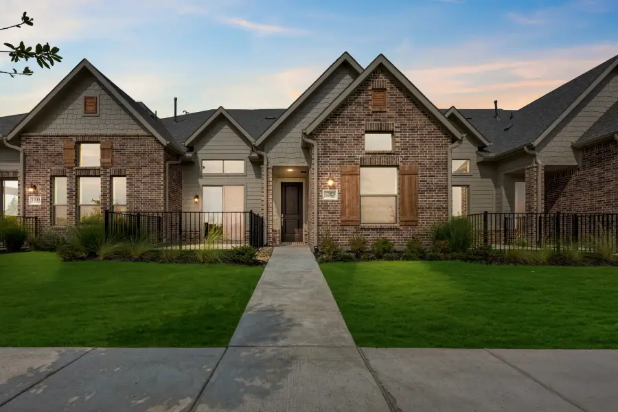Front exterior of a new home in Cottonwood Creek, Rowlett, TX, highlighting curb appeal (Image 29).
