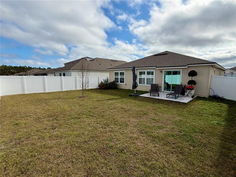 Exterior details and patio area of a home in Sawmill Branch Express, Palm Coast (Image 3).