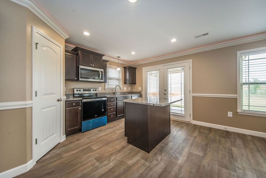 Representative furnished interior of a home built from the Reynolds by Enchanted Homes in Hampshire Heights, Moore (Image 12).