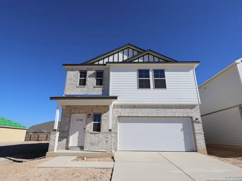 Front exterior of a new home in Winding Brook, San Antonio, TX, highlighting curb appeal (Image 1). Front exterior of a new home in Winding Brook, San Antonio, TX, highlighting curb appeal (Image 1).