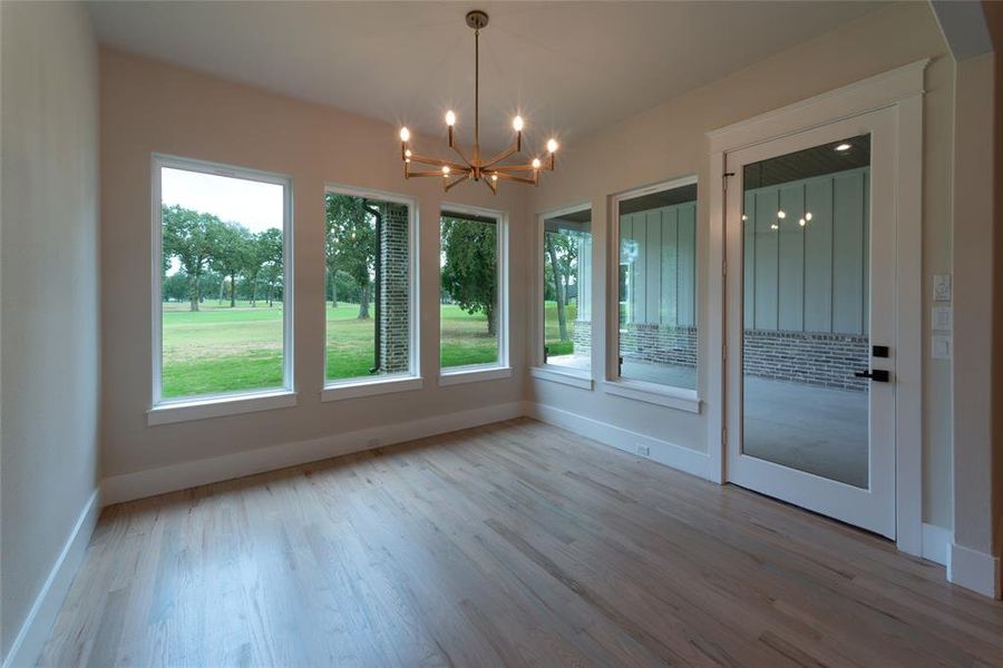 Dining room from kitchen with view of golf course.