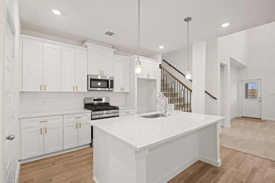 Furnished interior view inside a new home in Creekhaven, Iowa Colony (Image 6).