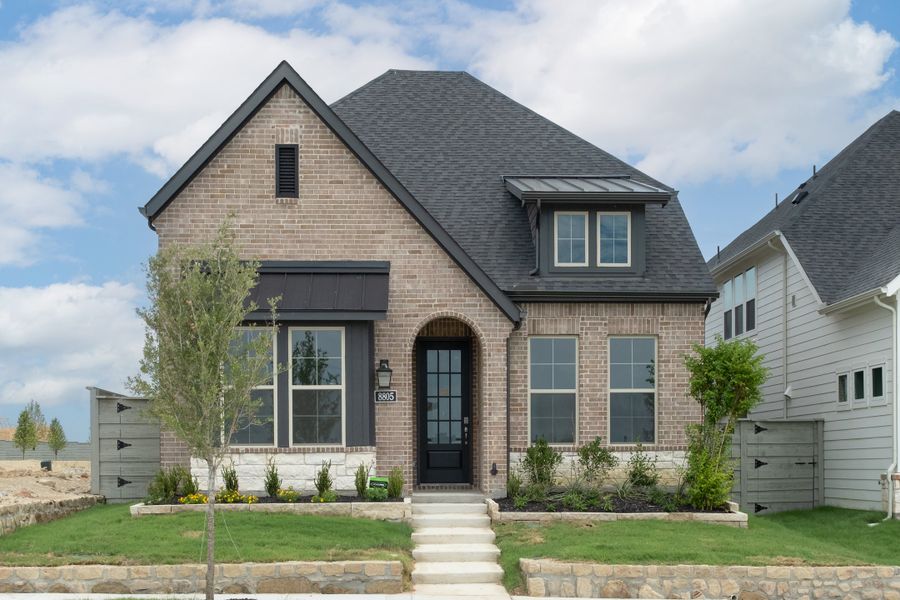 Front exterior of a new home in Treeline, Justin, TX, highlighting curb appeal (Image 1). Front exterior of a new home in Treeline, Justin, TX, highlighting curb appeal (Image 1).