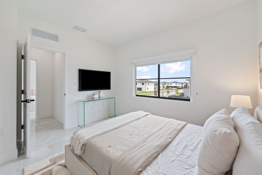 Representative furnished interior of a home built from the Model E by Onx Homes in On Alba, Florida City (Image 50).