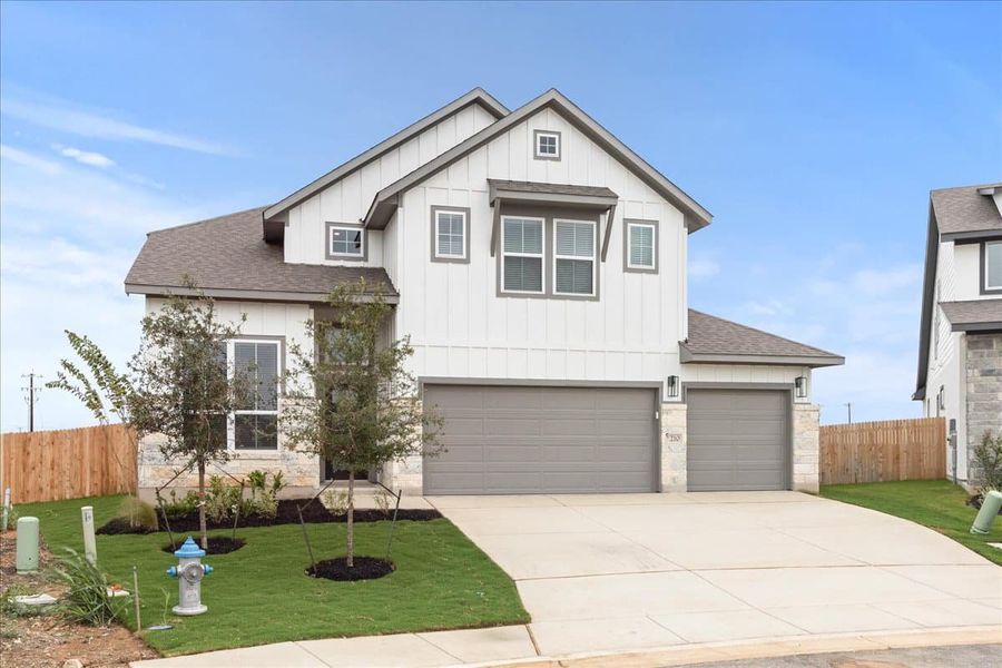 Front exterior of a new home in Village at Three Oaks, Seguin, TX, highlighting curb appeal (Image 18). Front exterior of a new home in Village at Three Oaks, Seguin, TX, highlighting curb appeal (Image 18).