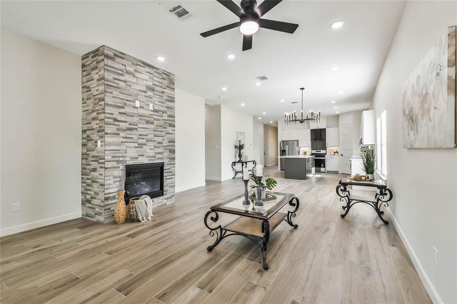 Gorgeous gas fireplace surrounded by stone adds warmth and charm to this brand new home.