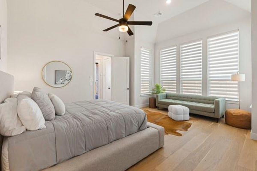 Bedroom featuring wood finished floors, ceiling fan, and recessed lighting