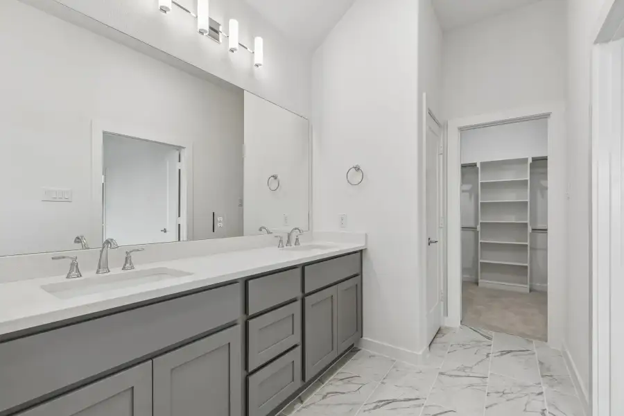 Primary Bathroom in the Claret home plan by Trophy Signature Homes – REPRESENTATIVE PHOTO