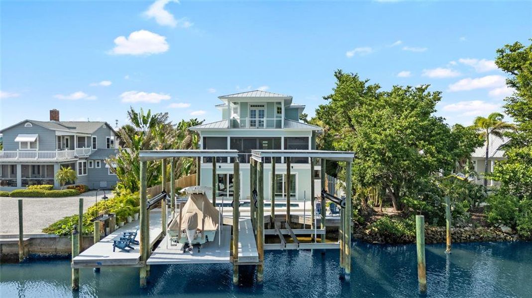 Front exterior of a new home in , Boca Grande, FL, highlighting curb appeal (Image 23). Front exterior of a new home in , Boca Grande, FL, highlighting curb appeal (Image 23).