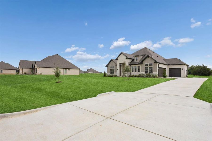 Front exterior of a new home in Joshua Meadows, Joshua, TX, highlighting curb appeal (Image 20). Front exterior of a new home in Joshua Meadows, Joshua, TX, highlighting curb appeal (Image 20).
