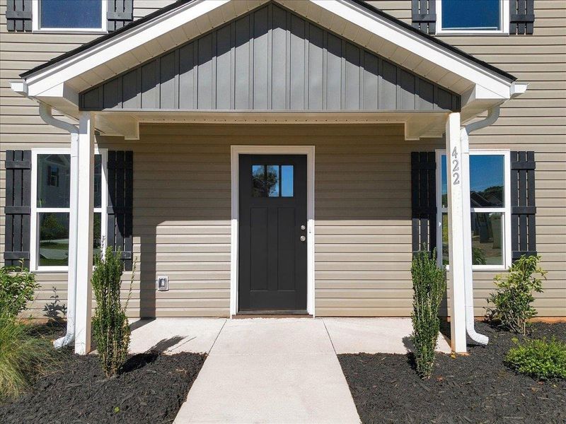Exterior details and patio area of a home in Stones Throw, Inman (Image 3).