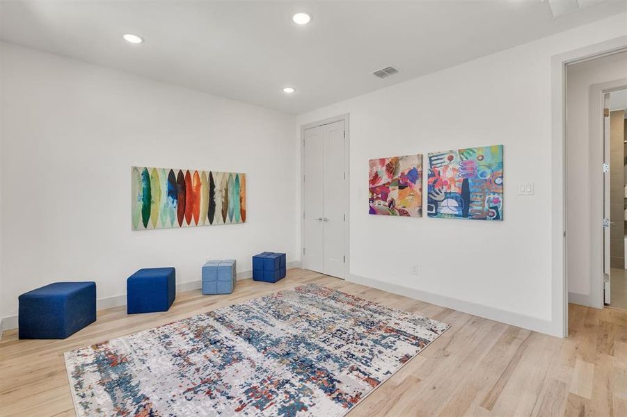 Living area featuring hardwood / wood-style flooring