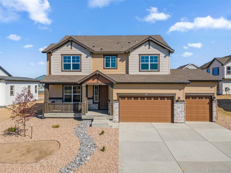Front exterior of a new home in Cherry Meadows, Brighton, CO, highlighting curb appeal (Image 20).