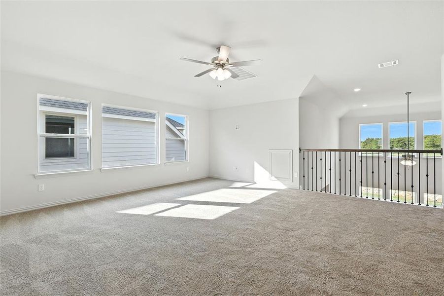 Carpeted spare room with ceiling fan and recessed lighting