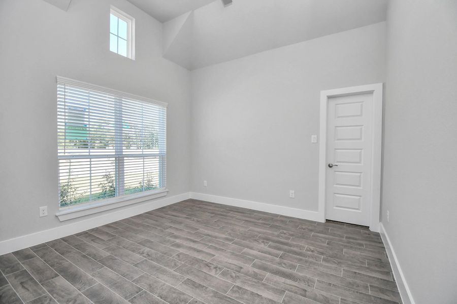 Step into the inviting home office, where elegant tile flooring adds a touch of freshness and comfort to the workspace. Natural light pours through the window, creating an inspiring environment for productivity and focus. Sample photo of completed home with similar floor plan. Actual colors and selections may vary. Step into the inviting home office, where elegant tile flooring adds a touch of freshness and comfort to the workspace. Natural light pours through the window, creating an inspiring environment for productivity and focus. Sample photo of completed home with similar floor plan. Actual colors and selections may vary.