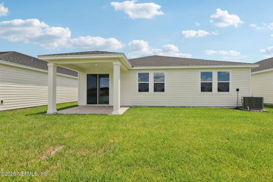 Front exterior of a new home in Lakes at Bella Lago - Signature Series, Green Cove Springs, FL, highlighting curb appeal (Image 18). Front exterior of a new home in Lakes at Bella Lago - Signature Series, Green Cove Springs, FL, highlighting curb appeal (Image 18).