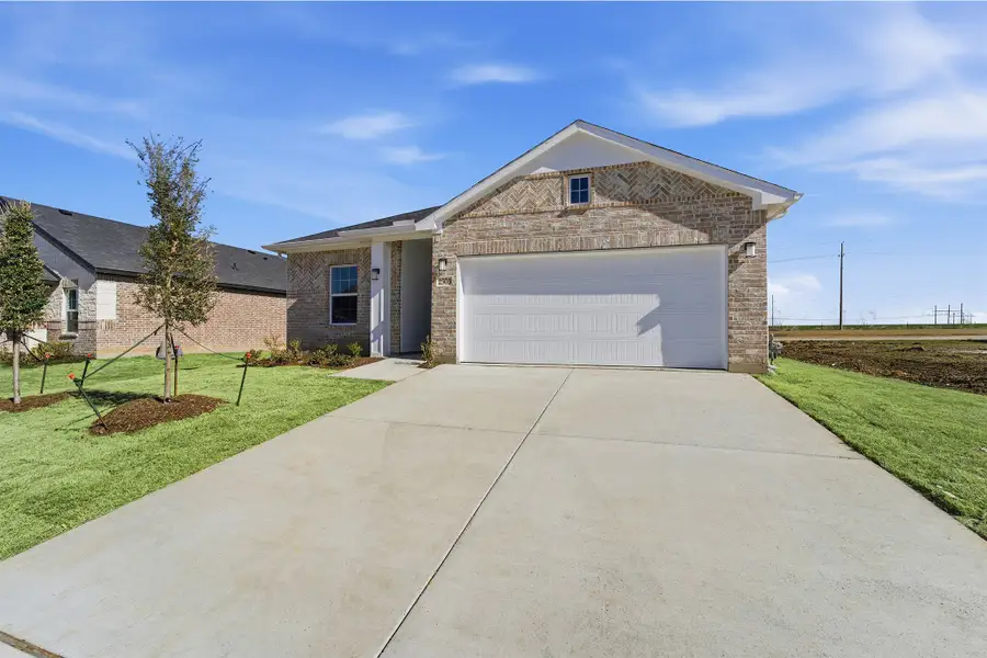 Front exterior of a new home in Pebblebrook, Sherman, TX, highlighting curb appeal (Image 2).