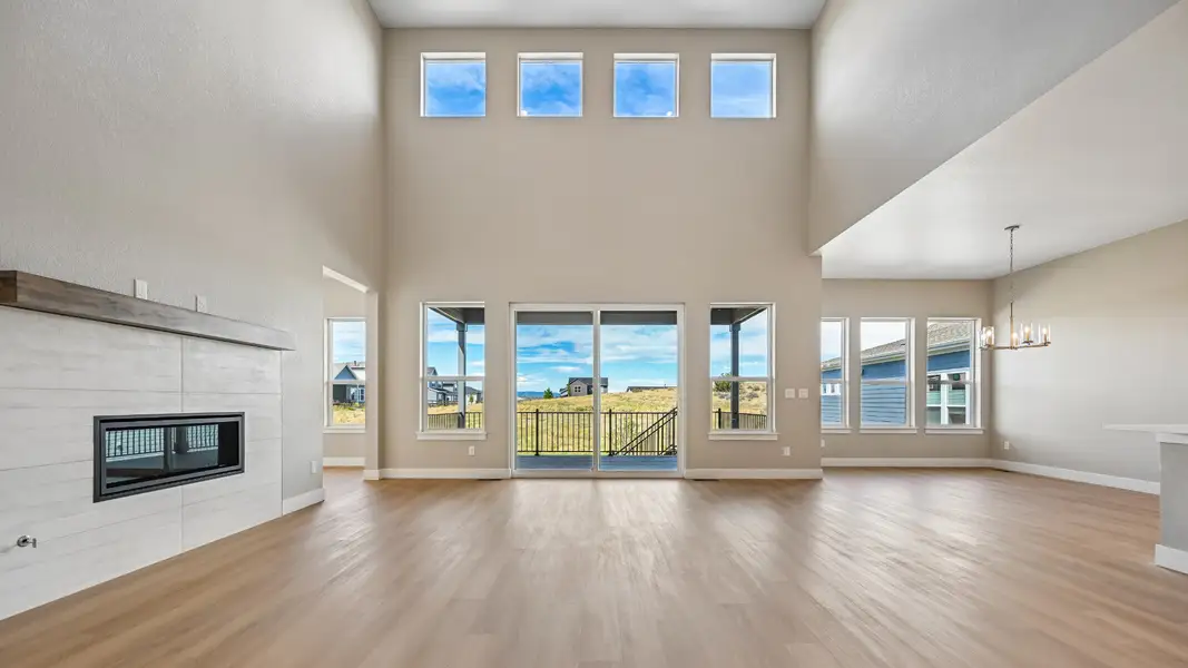 Gather around the fireplace in this inviting living space