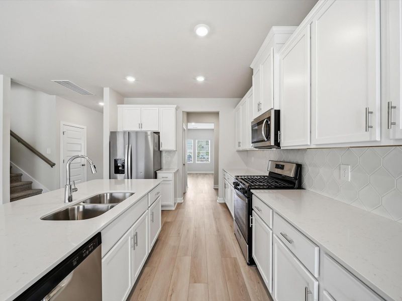 Furnished interior view inside a new home in The Farm at Wells Creek - Signature Collection, Gray Court (Image 5).