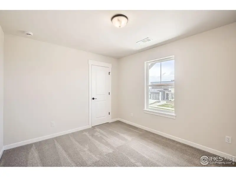 Spacious, unfurnished interior of a new home in RainDance, Windsor (Image 17).