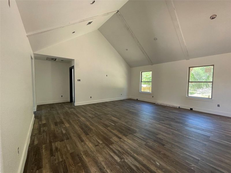 Living room, Vaulted ceiling, tons of natural light opens to kitchen.