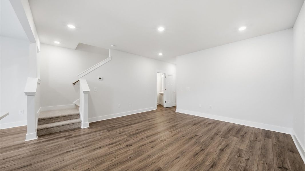 Tasteful family room with high ceilings, modern fixtures, and a warm, inviting feel located at Saluda Crossing Tasteful family room with high ceilings, modern fixtures, and a warm, inviting feel located at Saluda Crossing