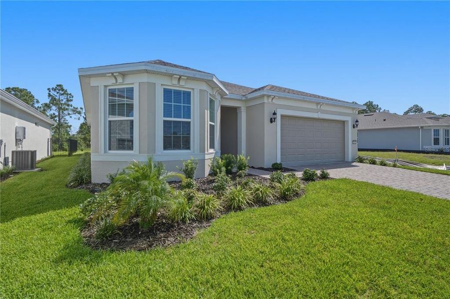 Front exterior of a new home in , St. Cloud, FL, highlighting curb appeal (Image 25).