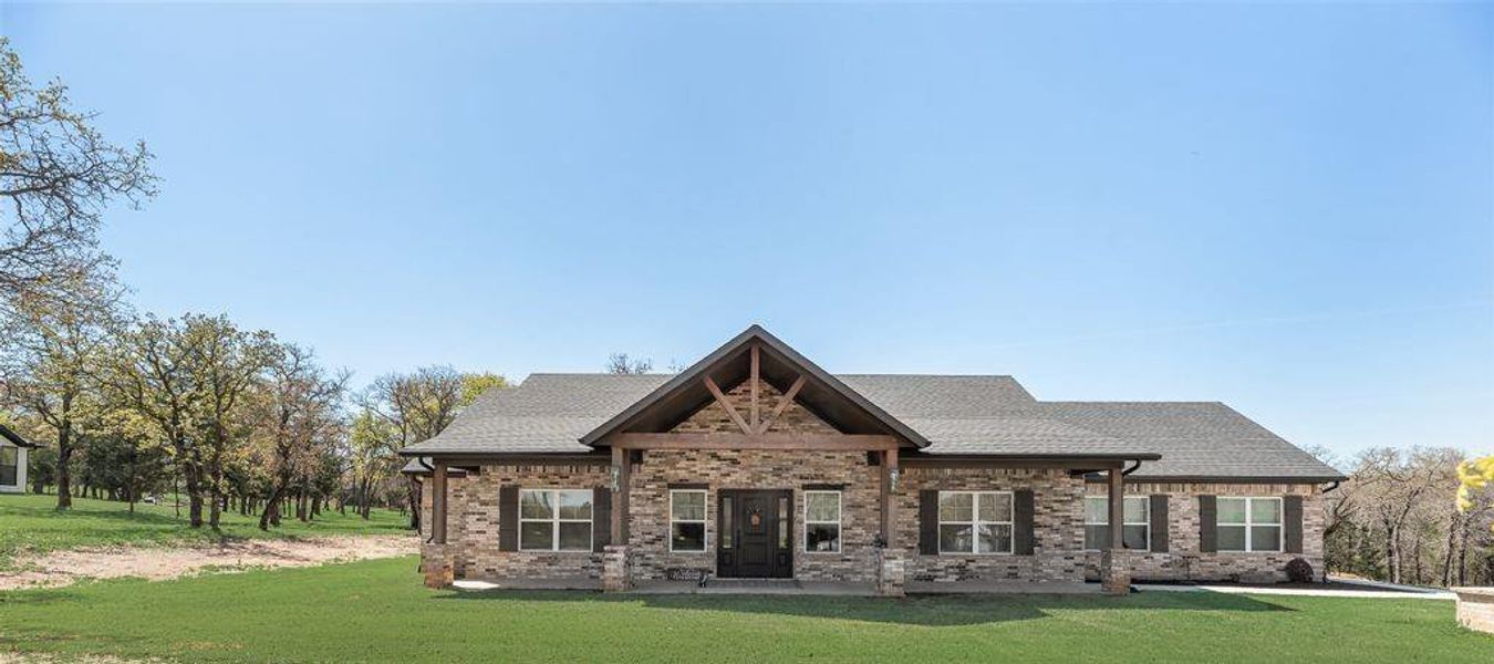 Amazing Newly Constructed custom home with amazing curb appeal, custom outside lighting, shudders, huge front porch on nearly 3 acres of Texas Tranquility! Sprinkler System and on a well so no water bill to pay