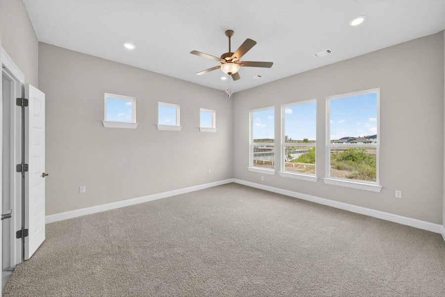 Unfurnished room featuring light colored carpet, ceiling fan, and recessed lighting Unfurnished room featuring light colored carpet, ceiling fan, and recessed lighting