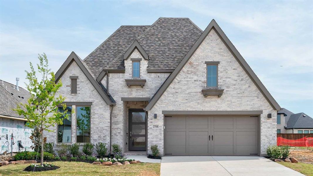 Front exterior of a new home in Cambridge Crossing, Celina, TX, highlighting curb appeal (Image 1). Front exterior of a new home in Cambridge Crossing, Celina, TX, highlighting curb appeal (Image 1).