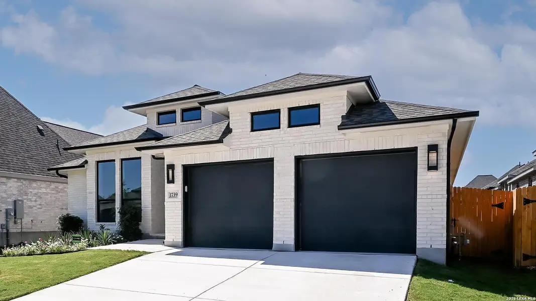 Front exterior of a new home in Meadows of Mill Creek, Seguin, TX, highlighting curb appeal (Image 22).
