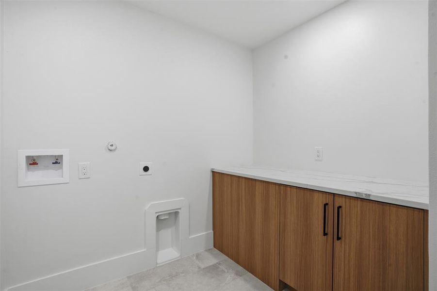 Utility room with full size washer & dryer hookups