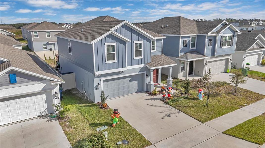 Front exterior of a new home in Peace Creek Reserve: Legacy Collection, Winter Haven, FL, highlighting curb appeal (Image 22). Front exterior of a new home in Peace Creek Reserve: Legacy Collection, Winter Haven, FL, highlighting curb appeal (Image 22).
