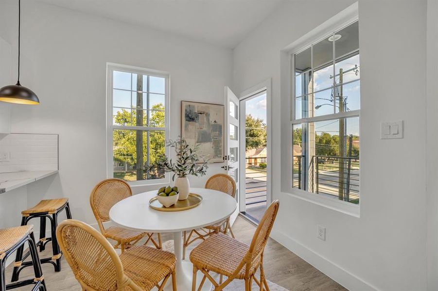 Dining area with plenty of natural light and light hardwood / wood-style floors