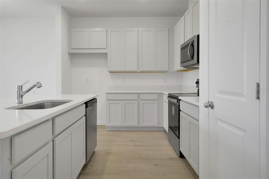 Furnished interior view inside a new home in Seaport Village, Tavares (Image 11).