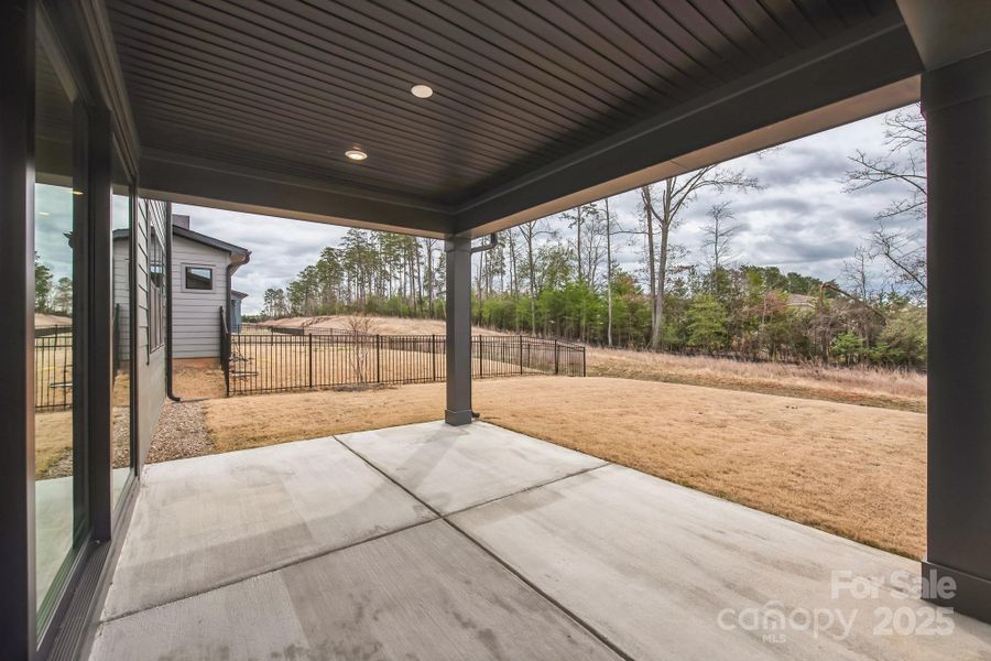 The back of the house opens up to a covered porch