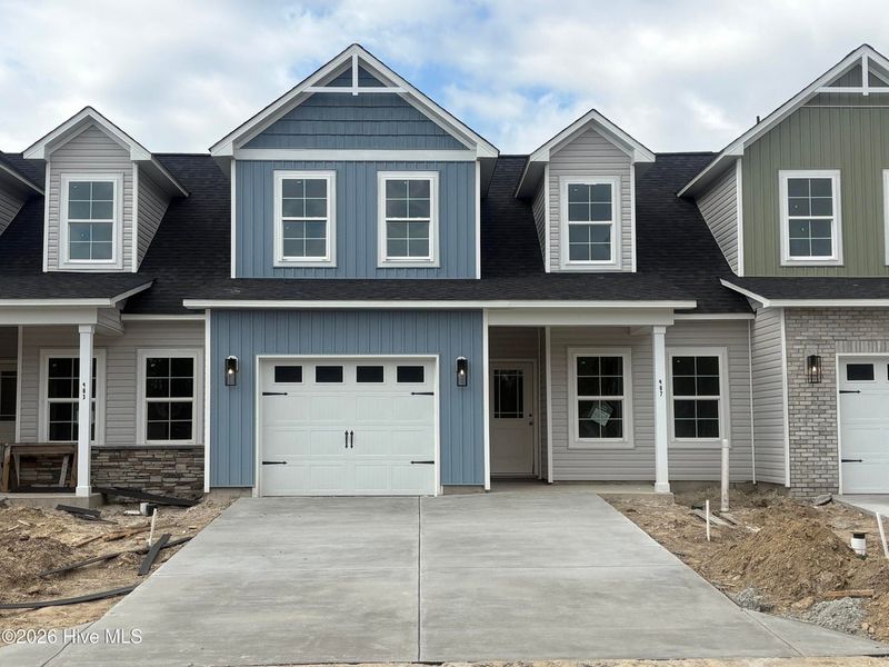 Front exterior of a new home in Autumn Trail, Bolivia, NC, highlighting curb appeal (Image 1). Front exterior of a new home in Autumn Trail, Bolivia, NC, highlighting curb appeal (Image 1).