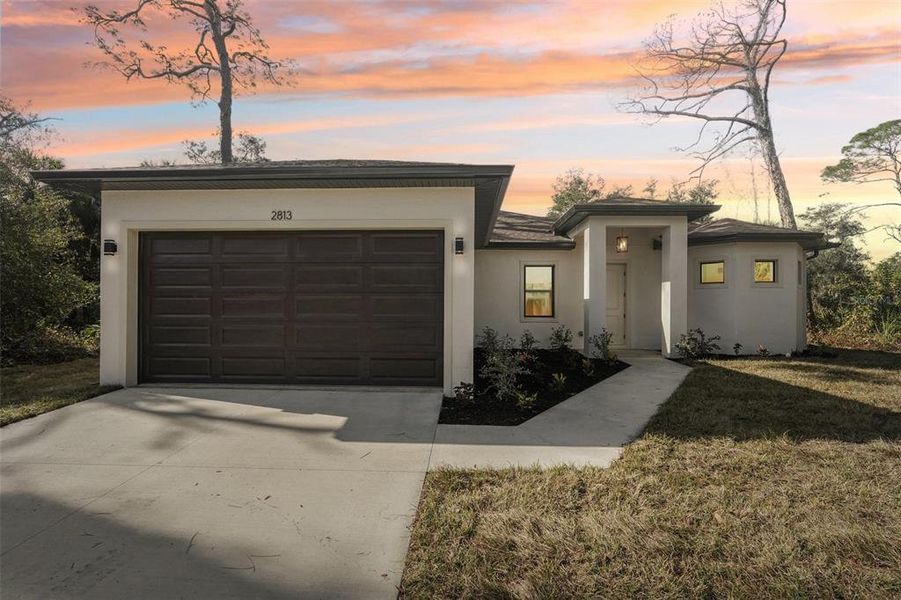 Front exterior of a new home in , North Port, FL, highlighting curb appeal (Image 23).