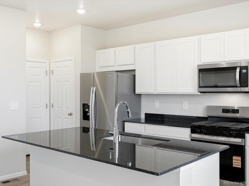 Furnished interior view inside a new home in , Commerce City (Image 8).
