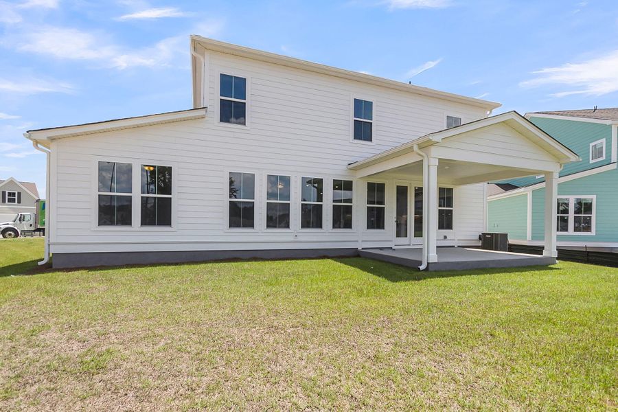 Front exterior of a new home in Tidewater at Lakes of Cane Bay, Summerville, SC, highlighting curb appeal (Image 28).